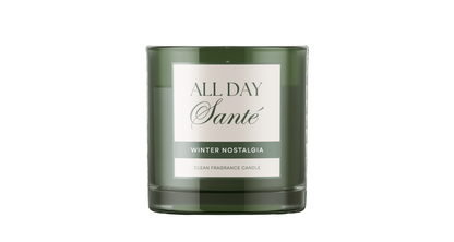 Green candle with a label on a white background